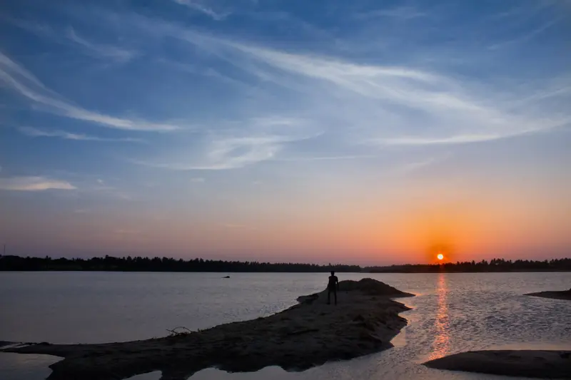 Sun rising over calm water near Puducherry